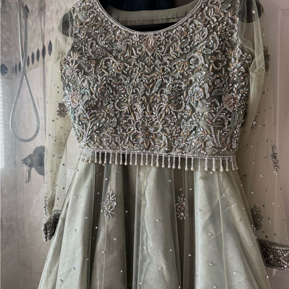 Mint green lengha choli with sheer sleeves